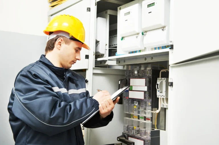Licensed electrician testing a newly installed electrical panel