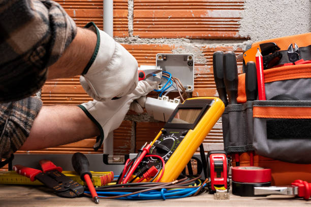 Licensed electrical contractor upgrading residential wiring for improved safety
