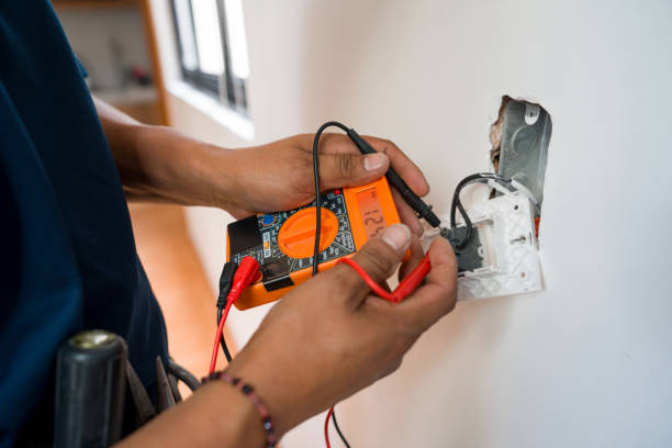Professional electrical contractor inspecting residential wiring and electrical system