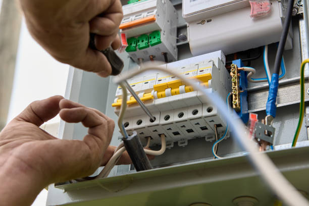 Licensed electrician replacing an outdated breaker panel in Belmont
