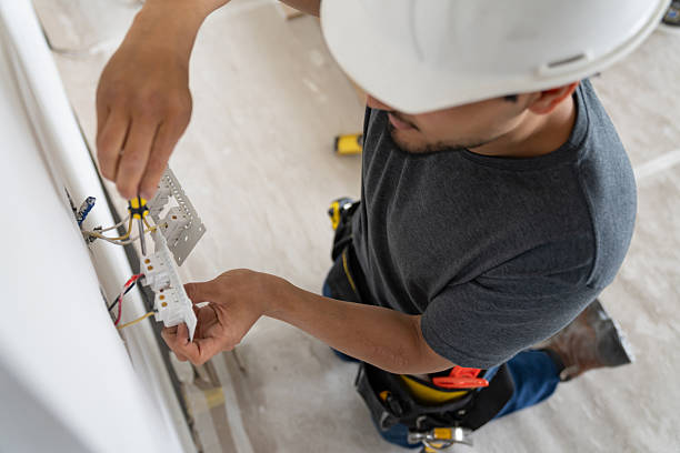 Licensed electrical contractor installing modern electrical panel in Belmont home